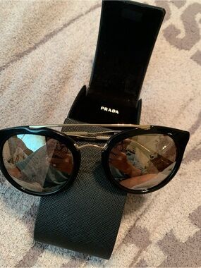 Prada Black Frame Sunglasses with Gold Bridge